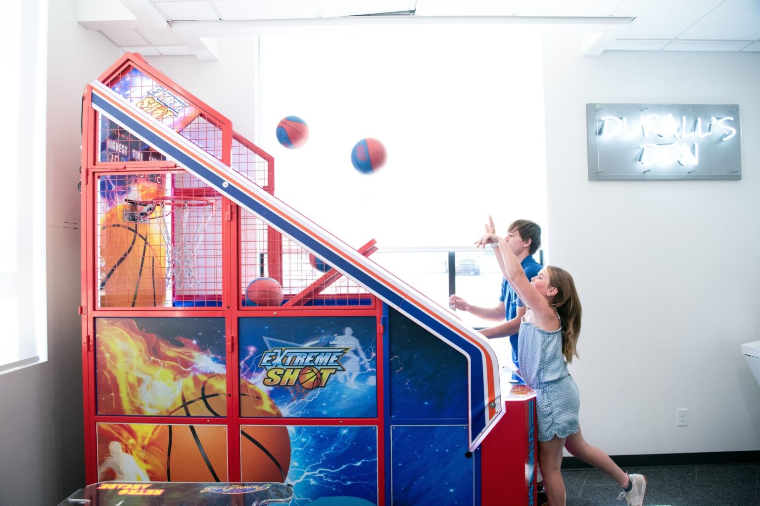 Kids playing games in the Wedding Thompson Orthodontics patient lounge
