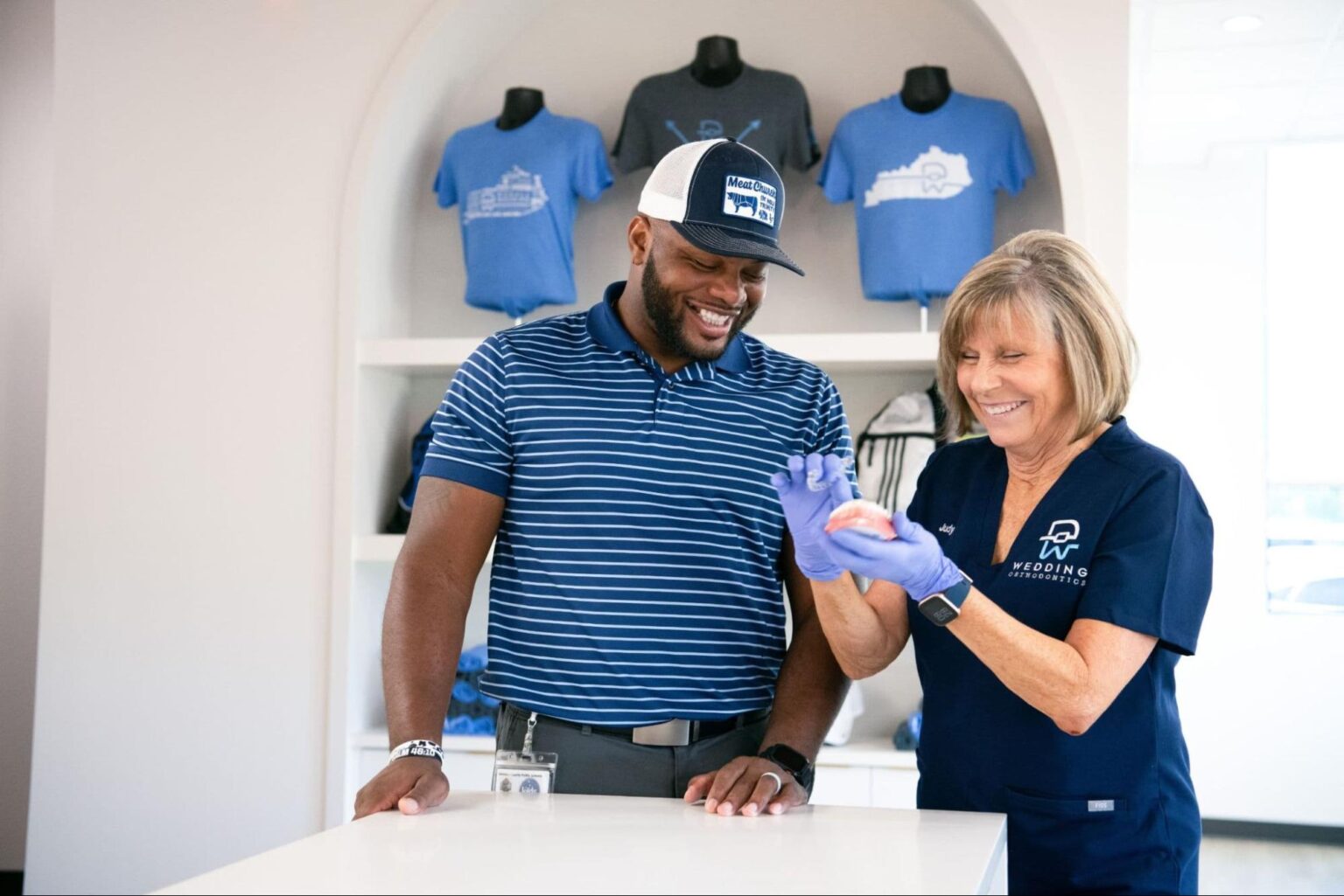 Wedding Thompson Orthodontics team member with a local athlete